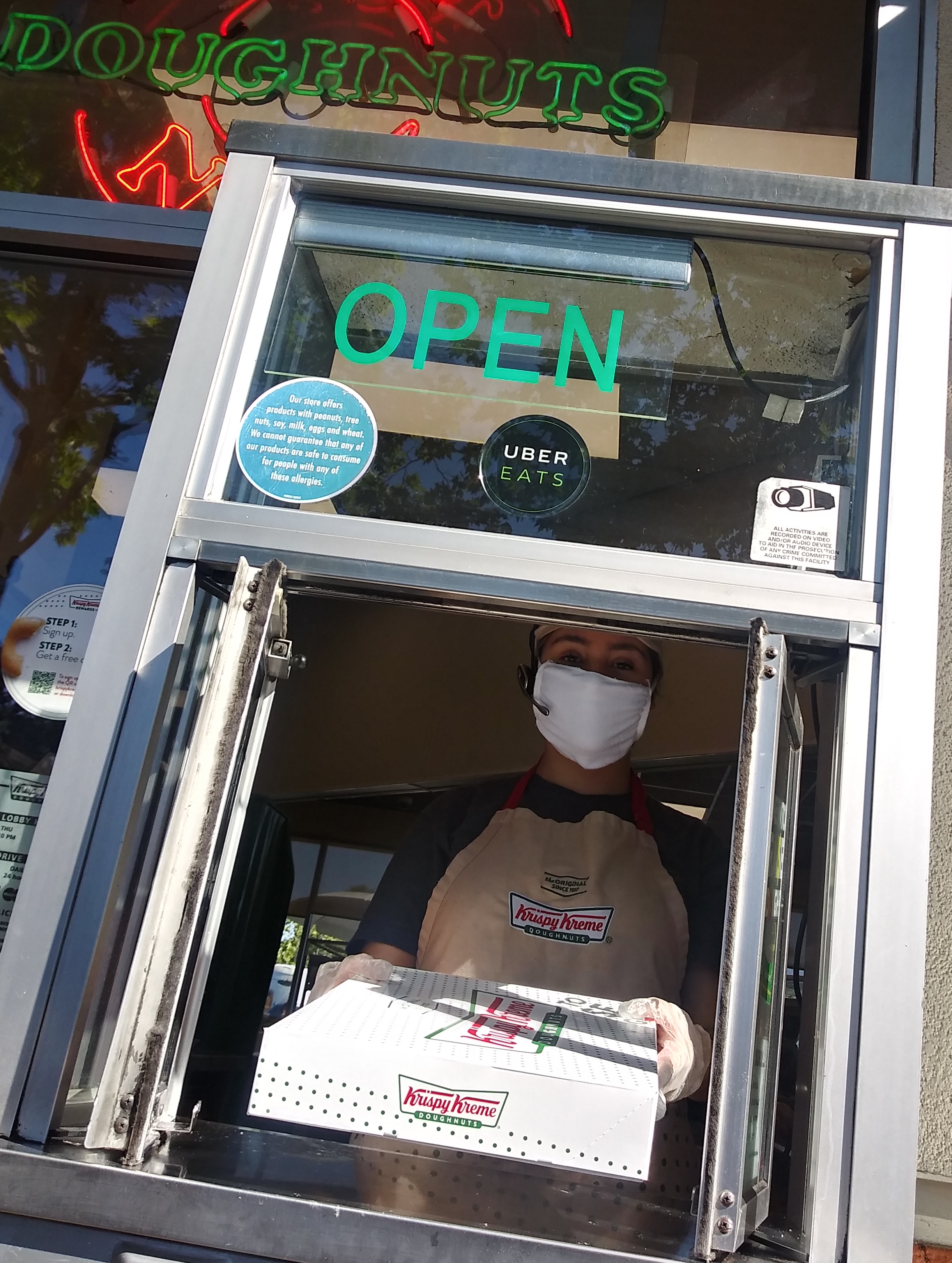 Krispy Kreme worker wearing a mask